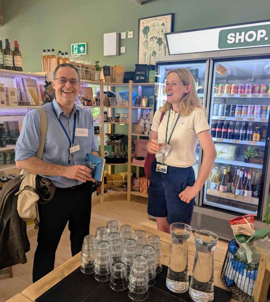 Attendees walking through a shop with stocked display shelves